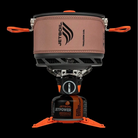 Jetboil stove system with brown pot on a black background